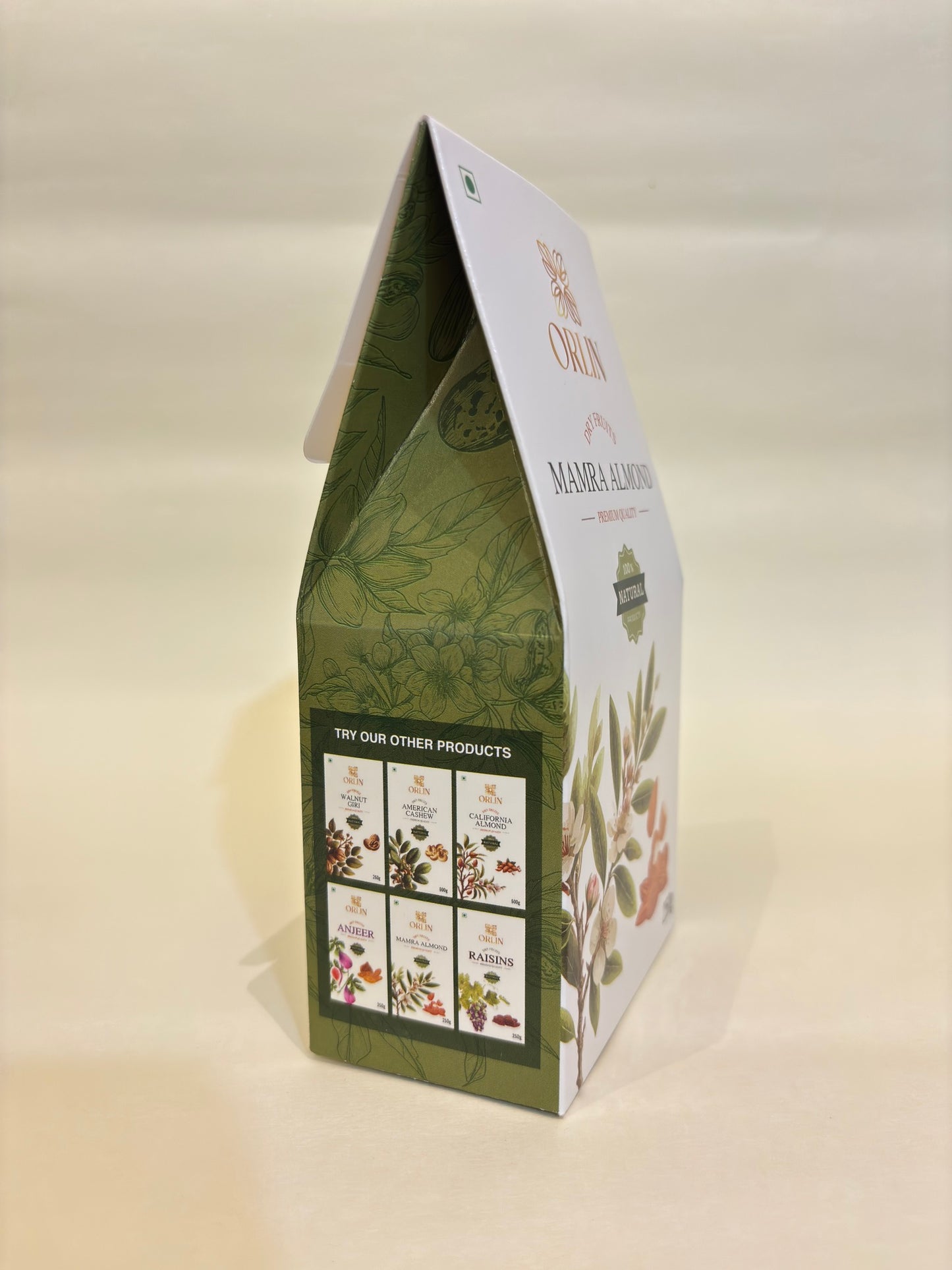 Green and white product packaging with botanical designs on a beige background
