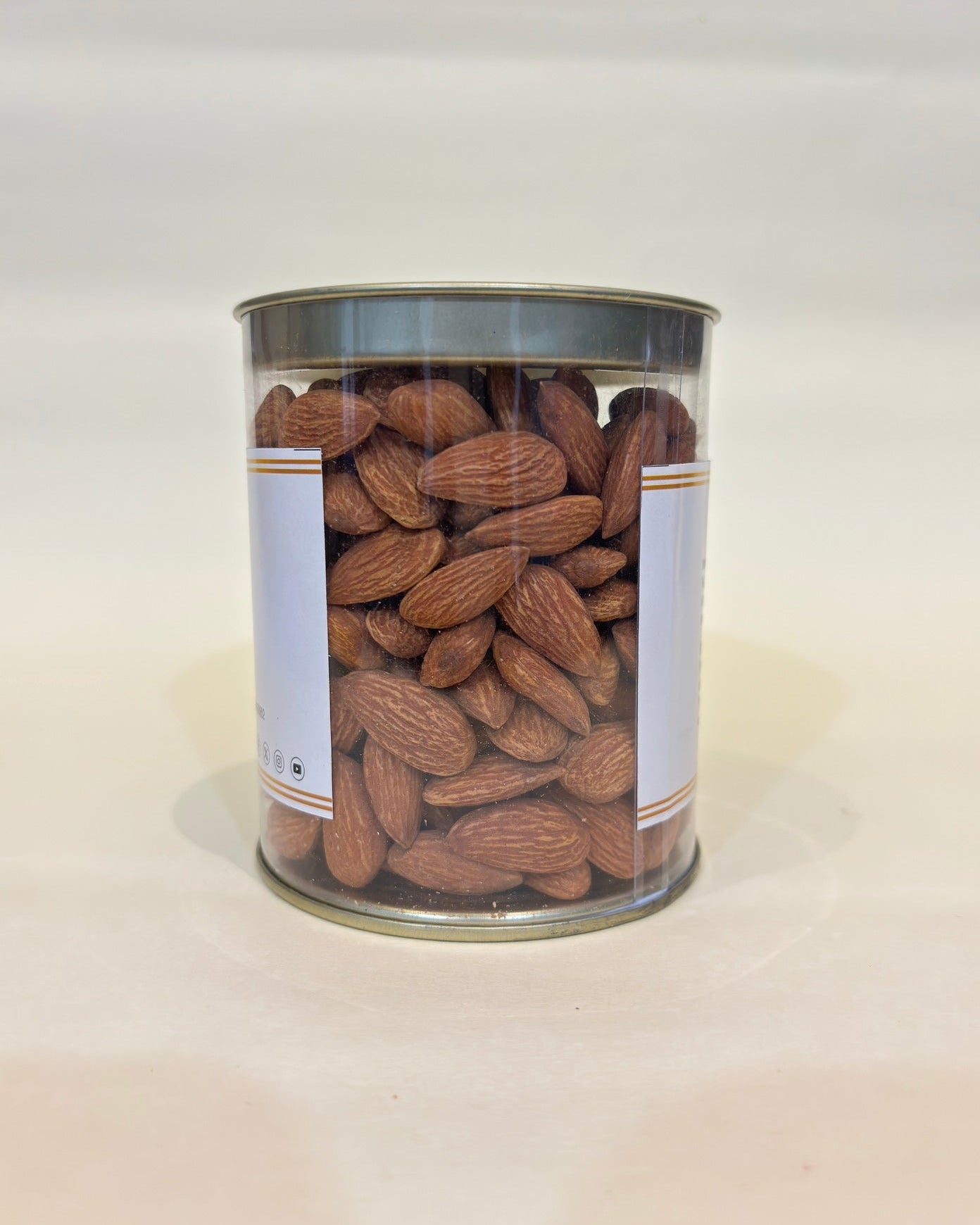 Can of almonds on a white background